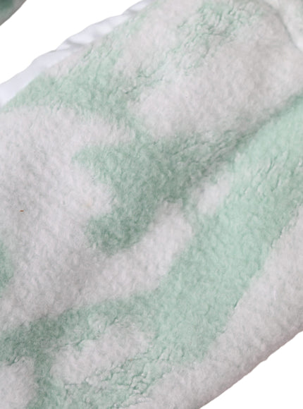 a close up of a towel on a white surface