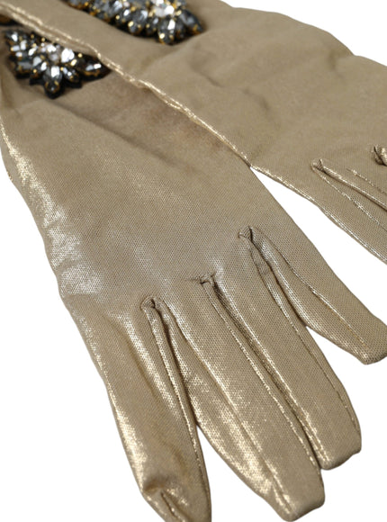 a pair of beige gloves with sequins on them