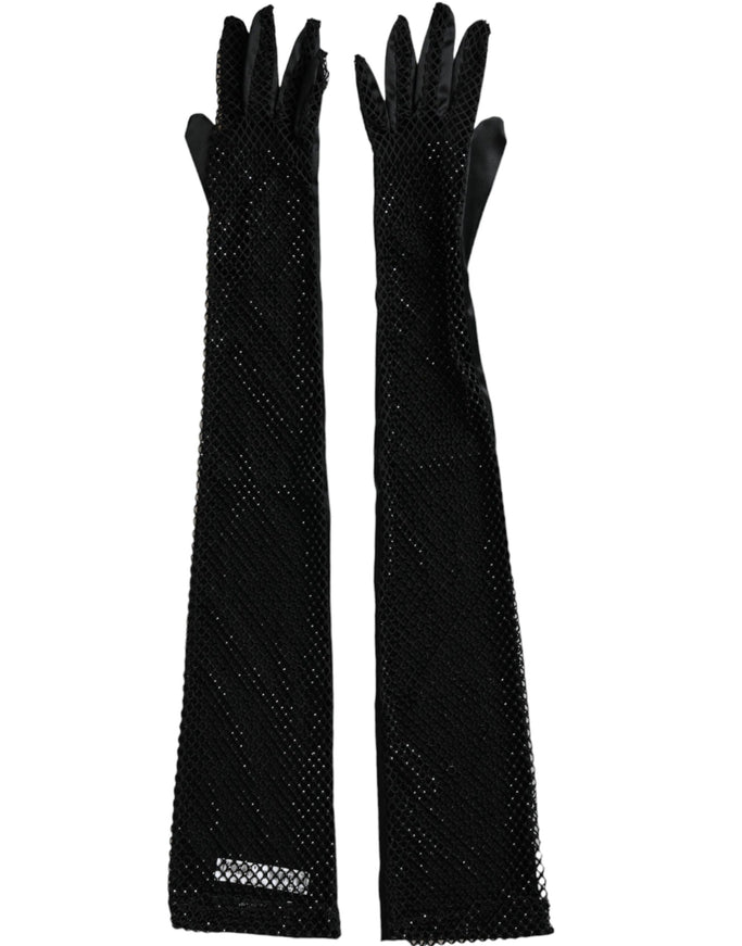 a pair of black gloves on a white background