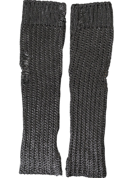 a pair of black knitted gloves on a white background