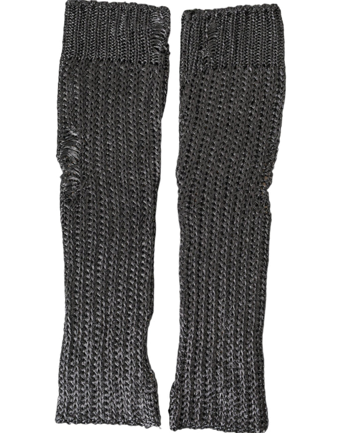 a pair of black knitted gloves on a white background