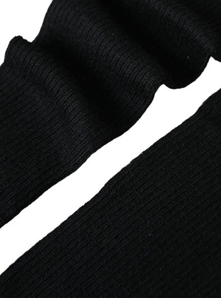 a pair of black socks sitting on top of each other