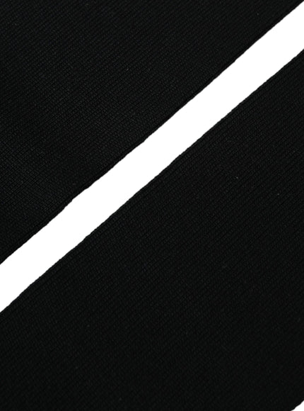 a close up of a black and white tie