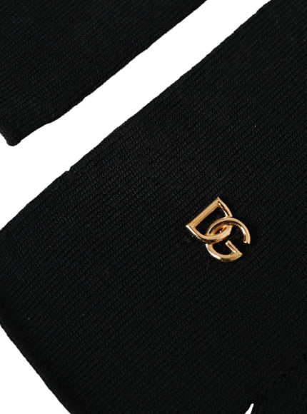 a black beanie with a gold logo on it