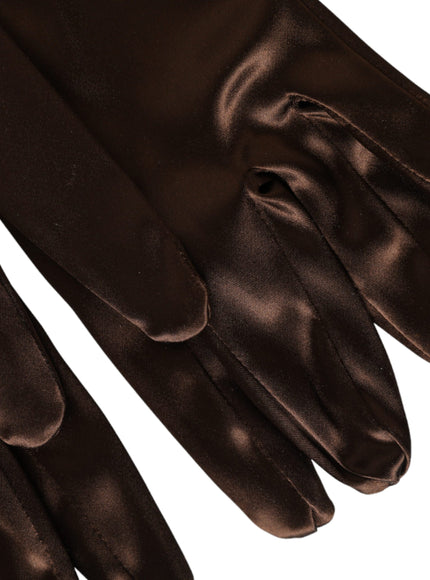 a pair of brown gloves on a white background