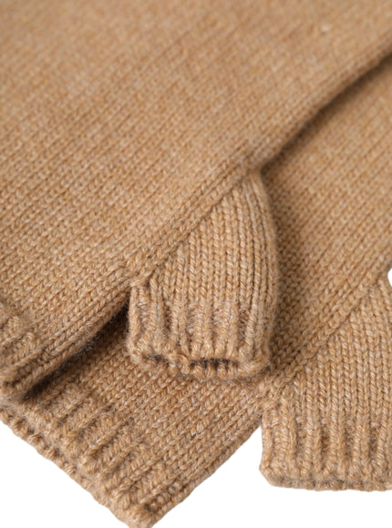 a close up of a brown sweater on a white background