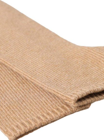 a close up of a pair of beige socks