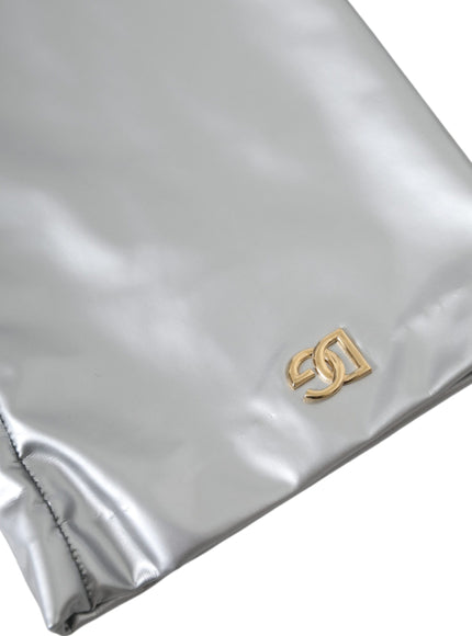 a silver bag with a gold logo on it