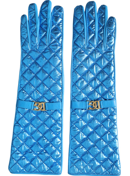 a pair of blue gloves with a gold buckle