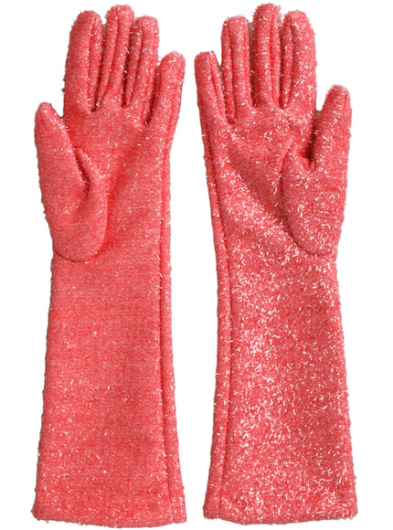 a pair of pink glittered gloves on a white background