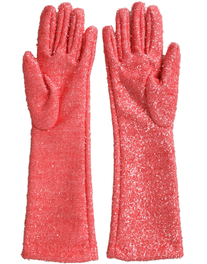 a pair of pink glittered gloves on a white background