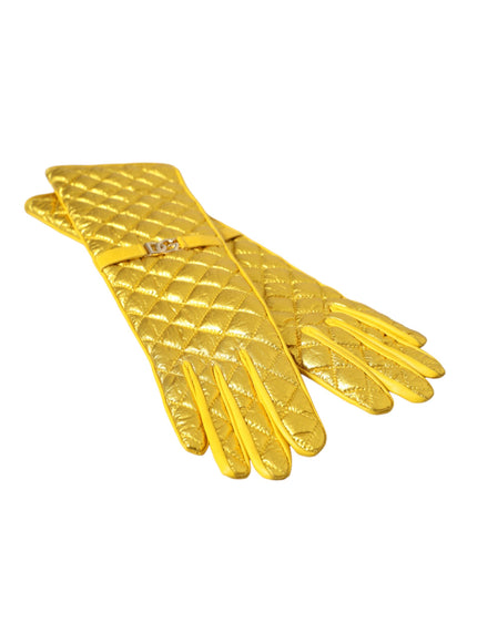 a pair of yellow gloves on a white background