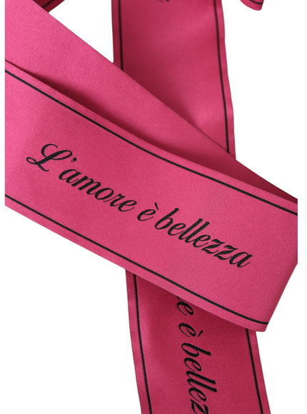 Close-up of pink belt with 'L'amore è bellezza' text