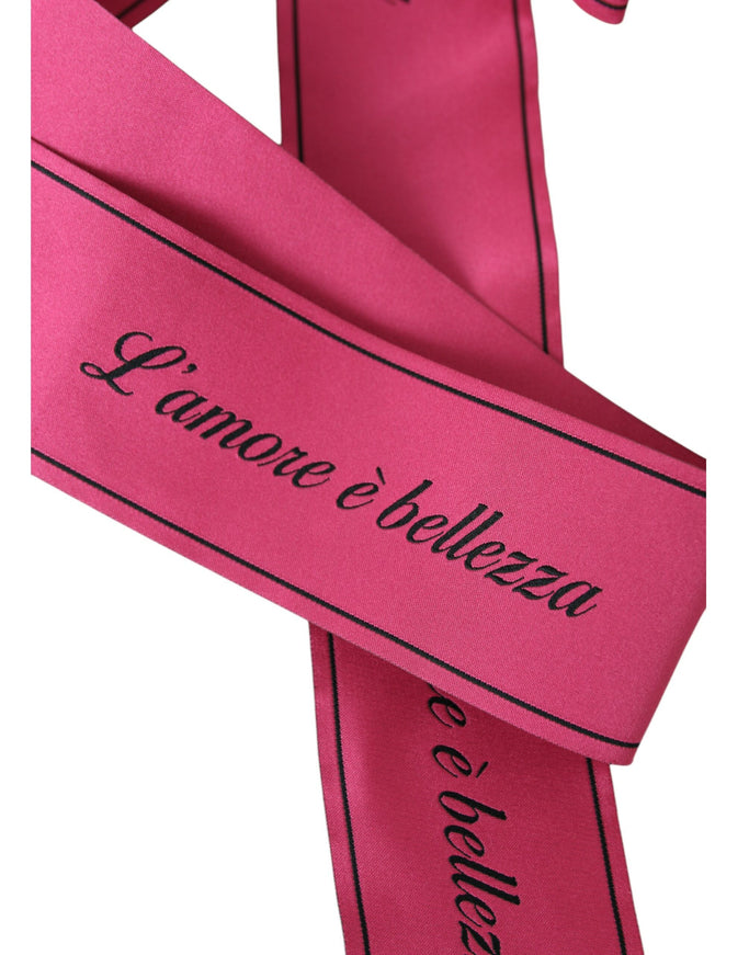 Close-up of pink belt with 'L'amore è bellezza' text