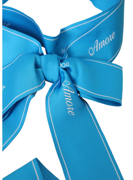 Close-up of blue AMORE waist belt bow detail