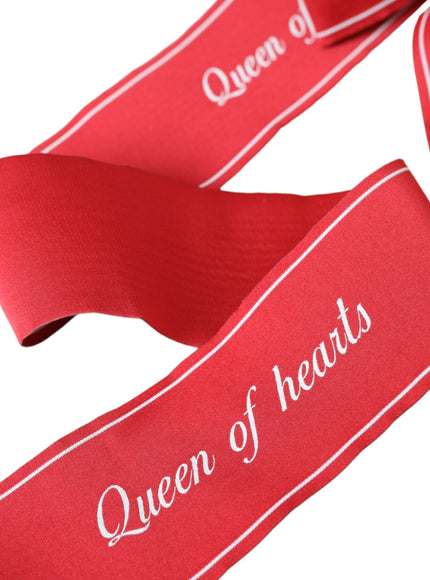 Close-up of red Queen of Hearts text on belt