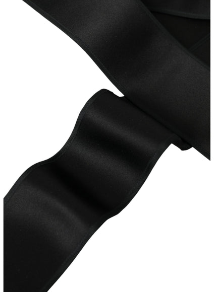 Close-up of black silk satin belt texture