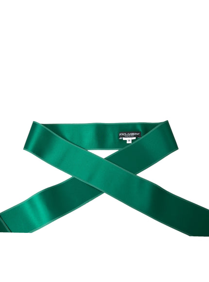 Unrolled green silk satin belt with label