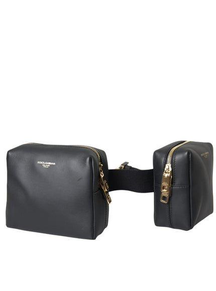 a pair of black leather bags with gold zippers