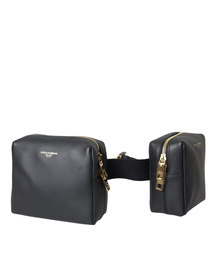 a pair of black leather bags with gold zippers