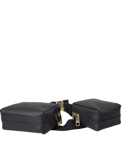 a pair of black luggage bags sitting on top of each other