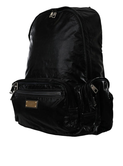 a black backpack that is on a white background