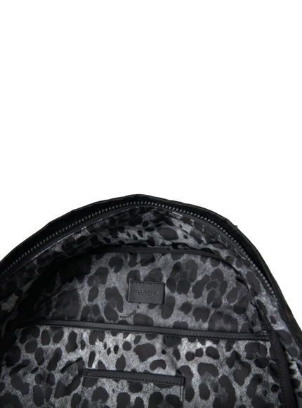 a black and white leopard print backpack on a white background