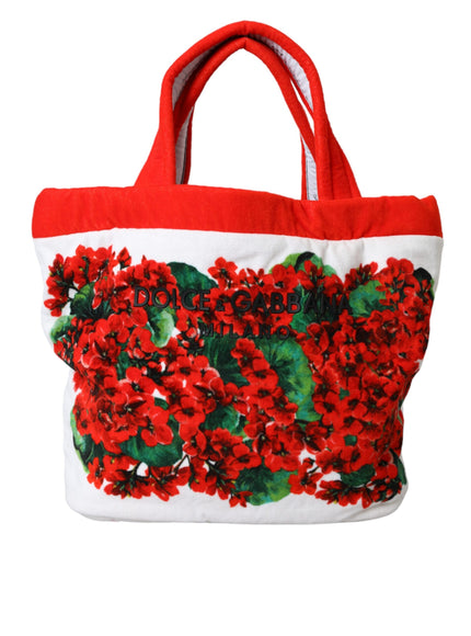 a red and white bag with red flowers on it