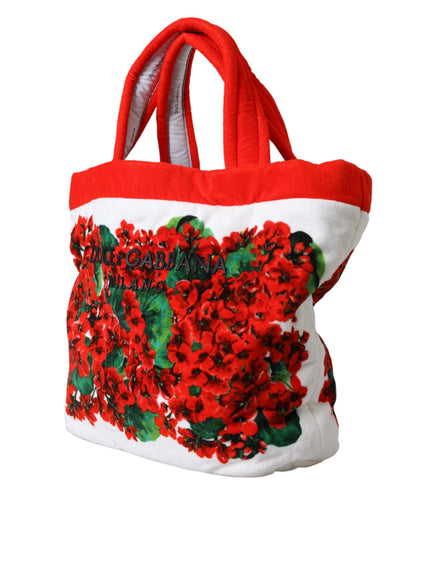 a red and white bag with red flowers on it