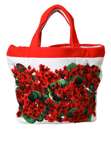 a red and white bag with red flowers on it