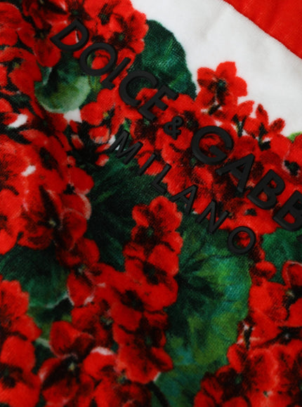 a close up of a red and green flowered cloth