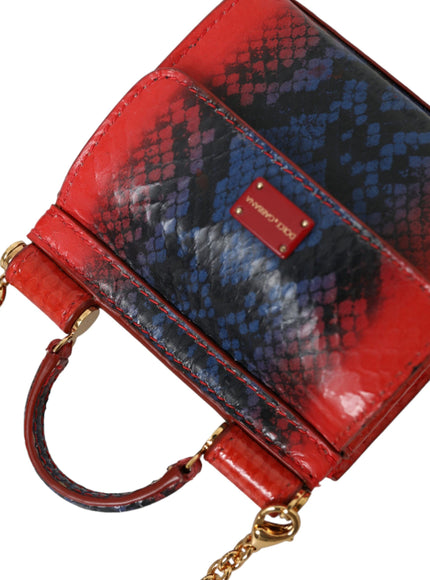 a red, blue, and black purse with a gold chain