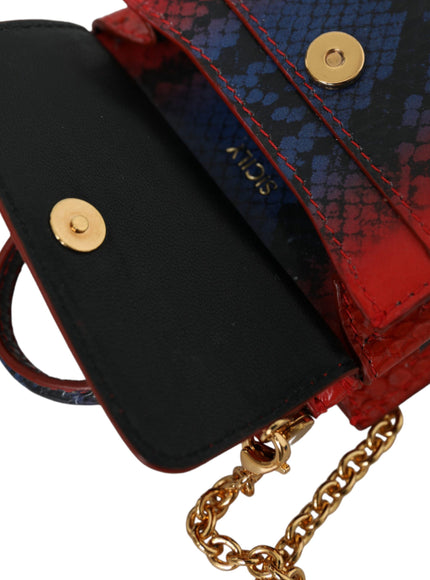 a red, blue and black purse with a chain