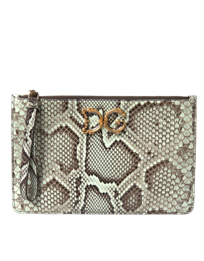 a purse with a snake skin pattern and gold hardware