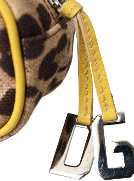 a giraffe print purse with a yellow strap