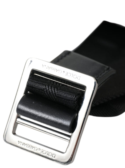 a black belt with a metal buckle on it