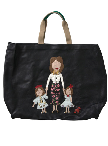 a black bag with a picture of a woman and two children