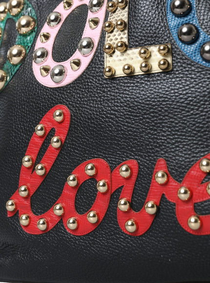 a handbag with the word love painted on it