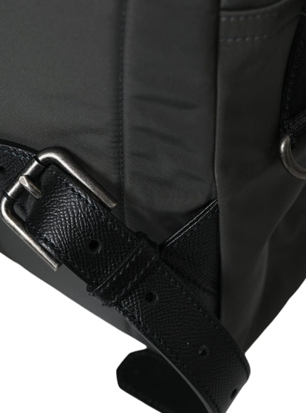 a close up of a black bag on a white background