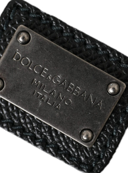 a black leather wallet with a metal tag on it