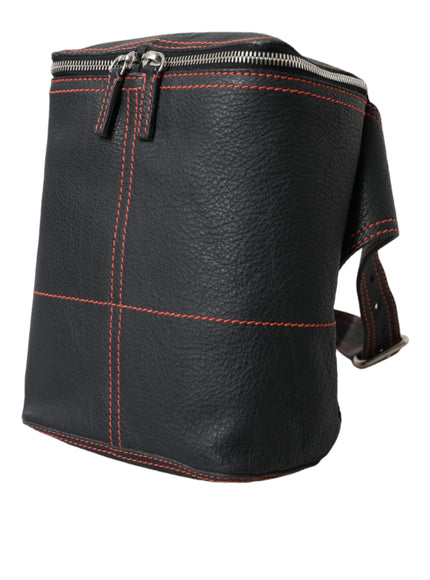 a black leather bag with red stitching