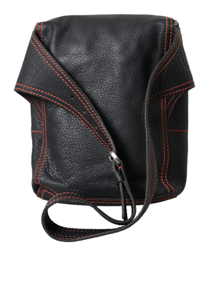 a black leather camera bag with red stitching