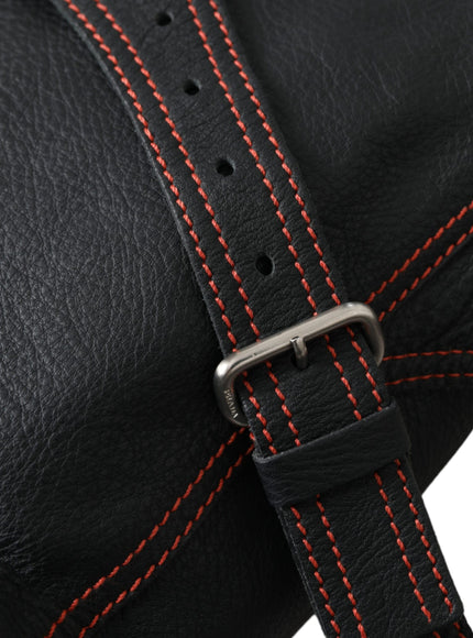 a black leather bag with red stitching