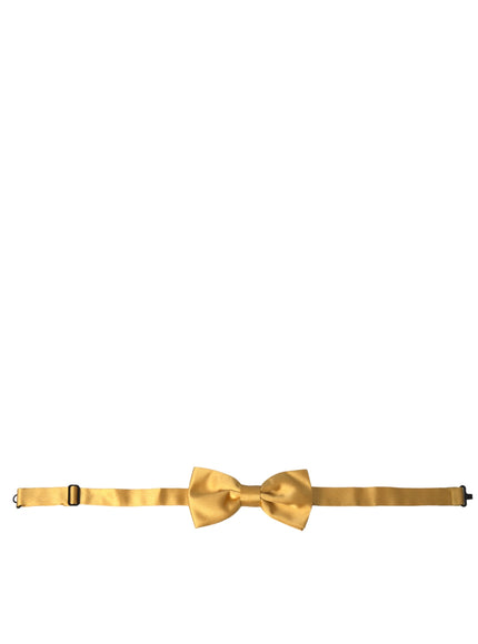 a gold bow tie on a white background