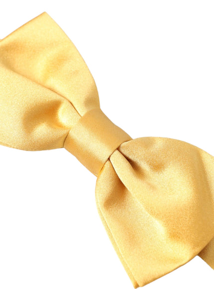 a yellow bow tie on a white background