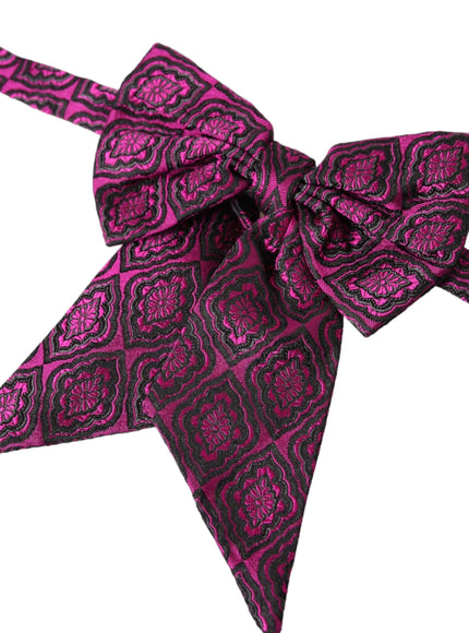 a close up of a pink and black bow tie