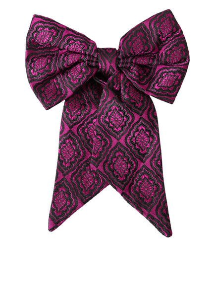 a pink and black bow tie on a white background