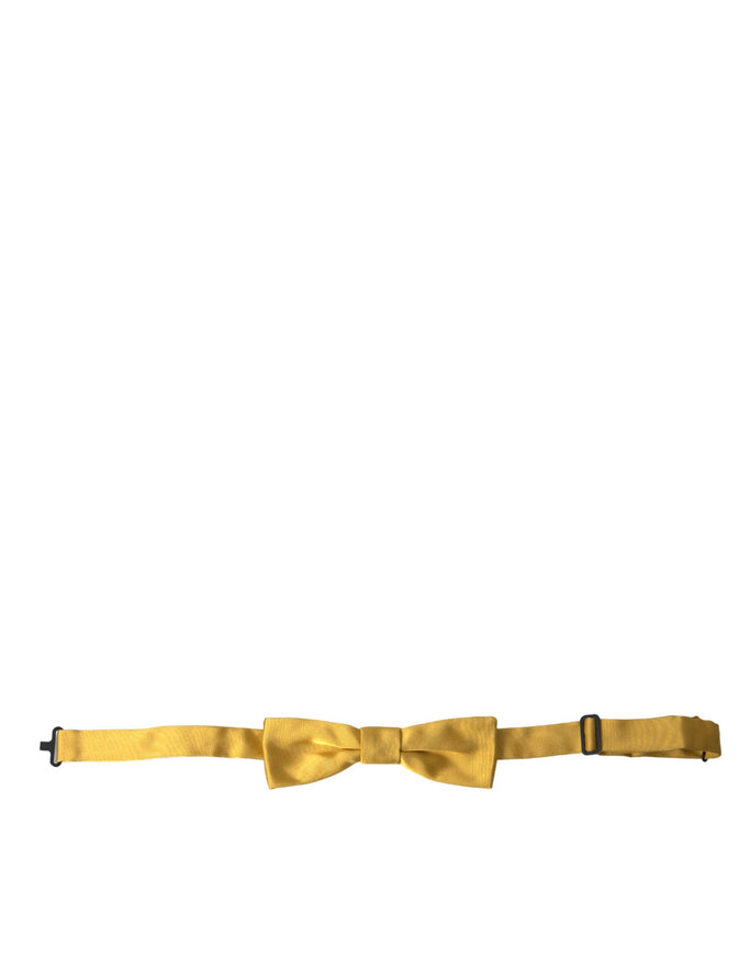 a yellow bow tie on a white background