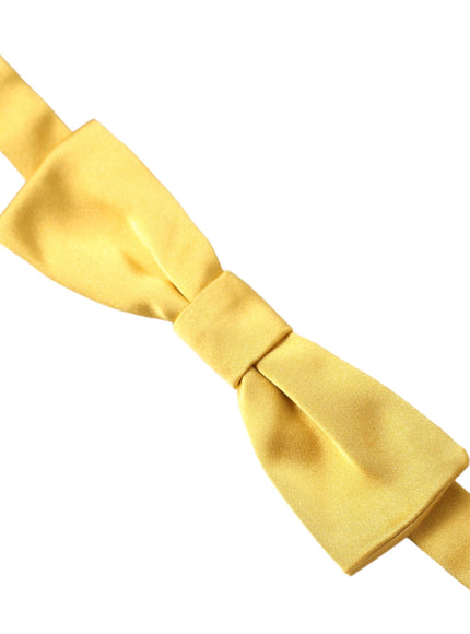 a close up of a yellow tie on a white background