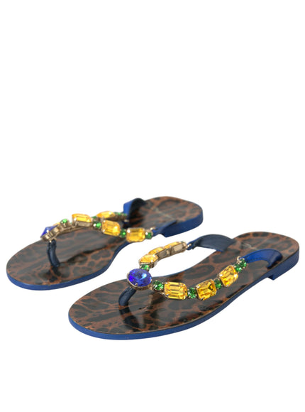 a pair of sandals with beads on them